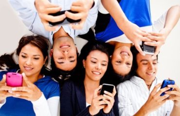 Young people texting on phones